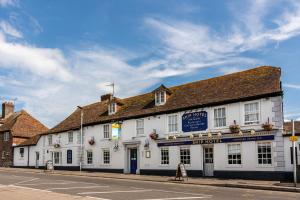 a white building on the side of a street at The Ship Hotel in New Romney