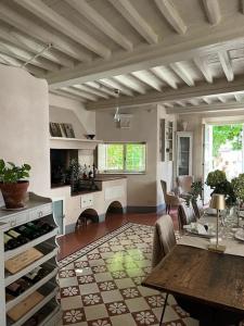 a kitchen with a table and a dining room at Locanda Sant' Agostino in Lucca