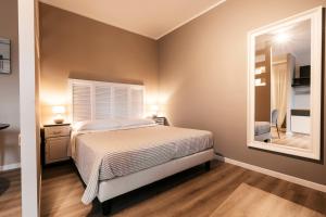 Postel nebo postele na pokoji v ubytování Mistral Apartments