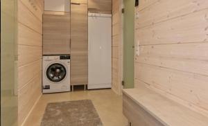 a laundry room with a washer and dryer at Villa Paadari in Inari