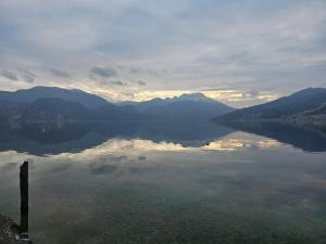 a view of a lake with mountains in the background at Ferienwohnung Attersee in Steinbach am Attersee