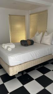 a woman laying on a large bed in a room at Janer House at San Juan in San Juan