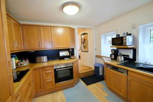 Dapur atau dapur kecil di Landjägerhaus am Südstrand - Wohnung 4 + 5