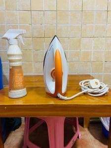 a telephone sitting on top of a wooden table at Serene Nest in Umm Al Quwain