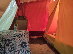 a room with a table in a tent at Different Belgrade camping in Vrčin