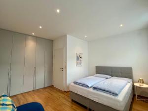 Postel nebo postele na pokoji v ubytování City Living Bischofshofen - Premium Stadtwohnung
