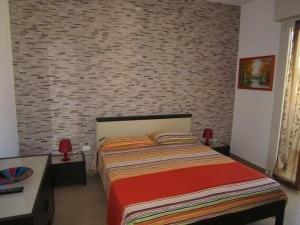 Postel nebo postele na pokoji v ubytování Cozy apartment in Gagliano del Capo 60 m² with spacious balcony