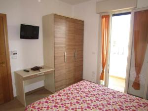 Postel nebo postele na pokoji v ubytování Cozy apartment in Gagliano del Capo 60 m² with spacious balcony