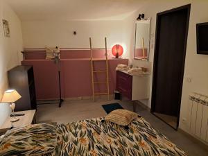 a bedroom with a bed and a desk and a mirror at Sous le soleil in Bandol