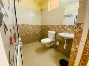 a bathroom with a toilet and a sink at OZIBA BEACH RESORT in Arambol +29 photos