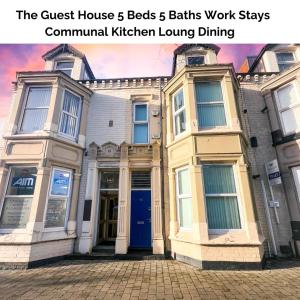 a building with the words the guest house beds baths work stays communal kitchen at Guest House 5 Beds 4 En-suites Middlesbrough in Middlesbrough