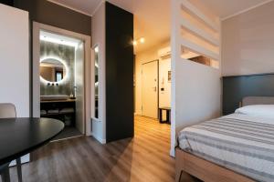 Postel nebo postele na pokoji v ubytování Mistral Apartments