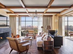 a living room with a couch and a fireplace at Bowie House, Auberge Resorts Collection in Fort Worth