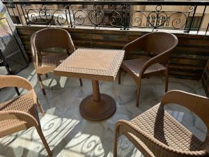 a table and chairs sitting on a balcony at Cairo apartment in Cairo