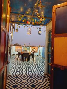 a dining room with a table and a tiled floor at The Mehran way Homestay in Jodhpur