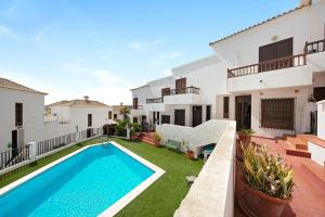 an image of a house with a swimming pool at Very well maintained house in Chayofa, the sunny south of Tenerife in Chayofa