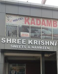 a sign on the side of a building at Hotel Kadamb, Palwal in Palwal