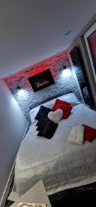 a bedroom with a bed with santa hats on it at Apartament z Jacuzzi in Kołobrzeg