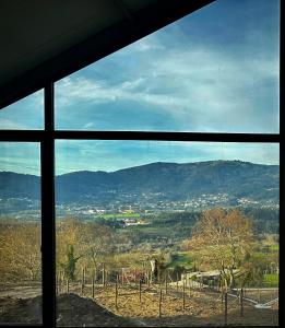 a view from a window of a mountain view at Carmo's Boutique Hotel - Small Luxury Hotels of the World in Ponte de Lima