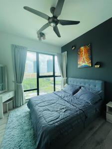 a bedroom with a bed and a ceiling fan at MidValley SouthKey Mosaic Tower B in Johor Bahru