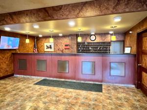 a lobby with a bar in a building at Lenox Hotel and Suites in Buffalo