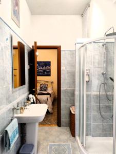 a bathroom with a sink and a shower at Attico Talenti in Rome