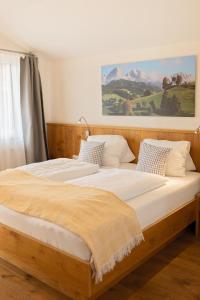 two beds sitting next to each other in a bedroom at Erlenhof in Maria Alm am Steinernen Meer