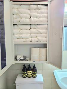 a bathroom with a toilet and towels at macity in Incheon