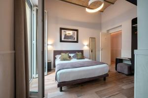 Llit o llits en una habitació de Hotel de' Clementi