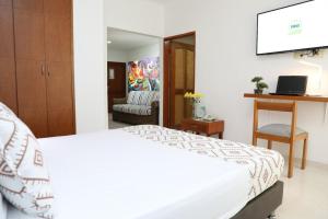 Ένα ή περισσότερα κρεβάτια σε δωμάτιο στο Hotel Guane