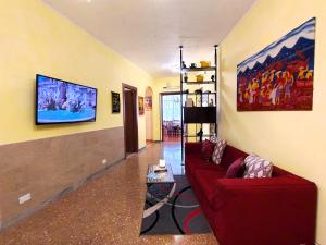 A television and/or entertainment centre at Attico Talenti