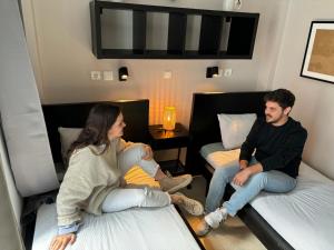 Posteľ alebo postele v izbe v ubytovaní Onefam Sants