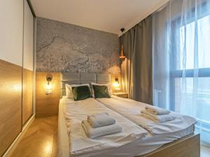 Posteľ alebo postele v izbe v ubytovaní City Center - Riverside by Apartmore + 37 fotografií