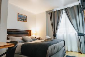 מיטה או מיטות בחדר ב-Hostal Concepcion