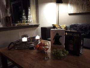 a table with fruit and candles on top of a room at Feriehus ved Barentshavet - Holiday home by the Barents Sea in Ytre Kiberg