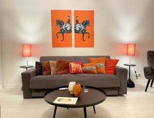 a living room with a couch and a table at Les Remparts Antibes Location in Antibes