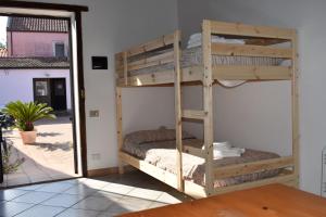 a bunk bed in the corner of a room at Agriturismo Trigna in Lamezia Terme