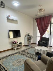 Μια τηλεόραση ή/και κέντρο ψυχαγωγίας στο AJ Homestay @ Kotasas