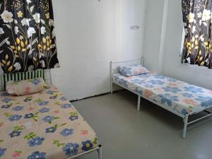 Letto o letti in una camera di Homestay Indrawasih