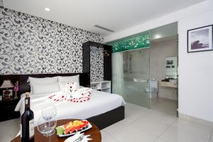 Postel nebo postele na pokoji v ubytování Dylan Hotel Danang + 37 fotografií