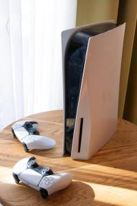 a nintendo wii game console and controllers on a table at Apartma Bazilika in Topolšica