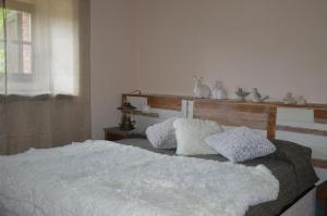 A bed or beds in a room at Podere San Cassiano