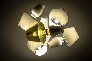a ceiling light with a bunch of objects on it at Hotel Universal in Livorno