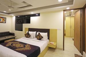 Voodi või voodid majutusasutuse Hotel D'Capitol - Delhi Airport toas