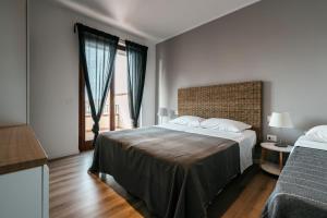 Postel nebo postele na pokoji v ubytování Mistral Apartments