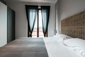 Postel nebo postele na pokoji v ubytování Mistral Apartments