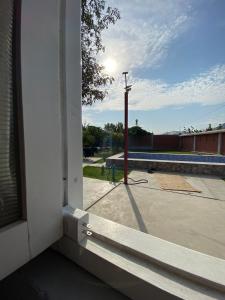 an outside window of a building with a street light at Casa Polska in Paiján