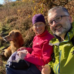 a man and a woman sitting next to a dog at Crafnant House - Bed & Breakfast in Trefriw +63 photos