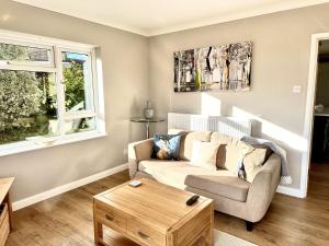 A seating area at Renovated Cottage in Sherborne with Stunning Views