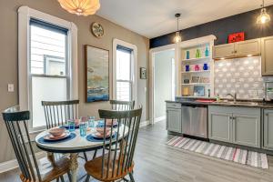 a kitchen and dining room with a table and chairs at Pet-Friendly Indianapolis Retreat Near City Center in Indianapolis